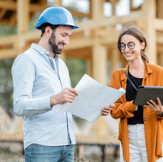 builder-with-a-female-client-on-the-construction-s-CY77BWG.jpg