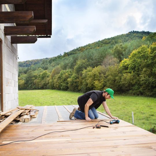 handyman-installing-wooden-flooring-PDAV734.jpg